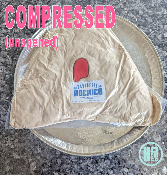 Compressed photo of Empanada plush cushion.