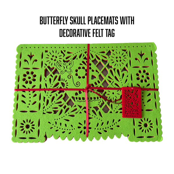 Butterfly Skull placemats with decorative tag, wrapped in red ribbon.