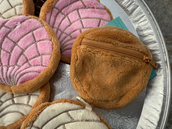 Concha Coin Purses on a  platter.