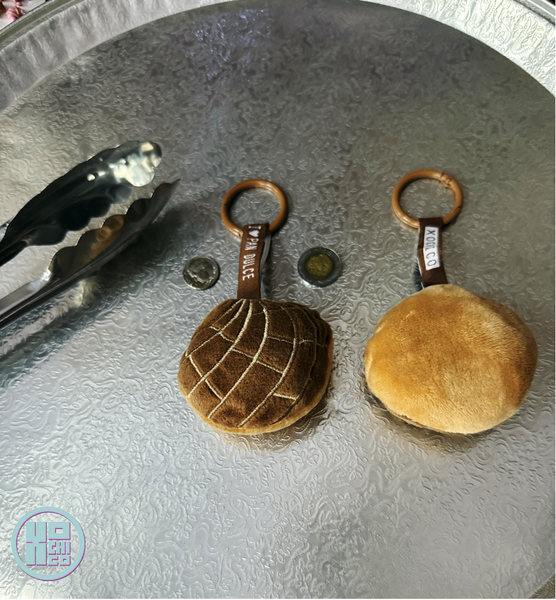 Plush concha key chain with ribbon carabiner.