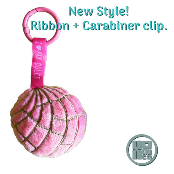 Strawberry plush concha key chain with ribbon and carabiner clip designed by Xochico.