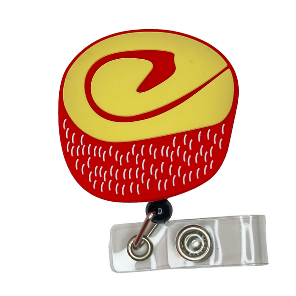 Nino Envuelto badge reel