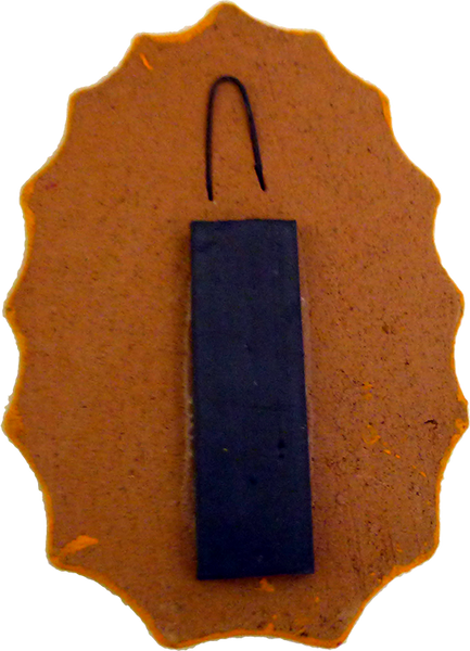 Virgencita clay magnet, back view